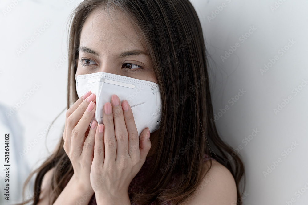 Woman wearing face mask for Prevent New coronavirus 2019-nCoV from China Woman wearing face mask for Prevent New coronavirus 2019-nCoV from China