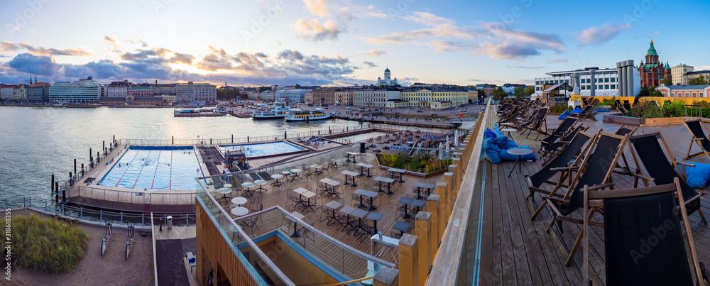 Helsinki. Finland. Panorama of the waterfront of Helsinki. Outdoor swimming pool in Finland. Seating area in the harbour of Helsinki. Nicholas cathedral. Suurkirkko. Harbor for cruise ships.