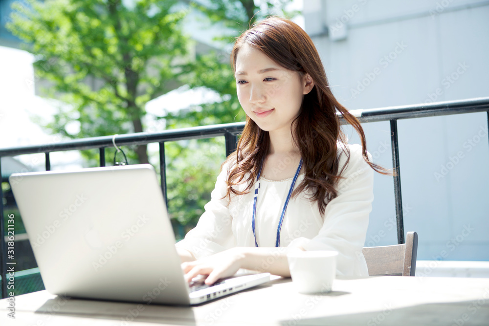 Young woman using laptop on terrace Young woman using laptop on terrace