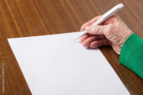 Old hands with blank paper
