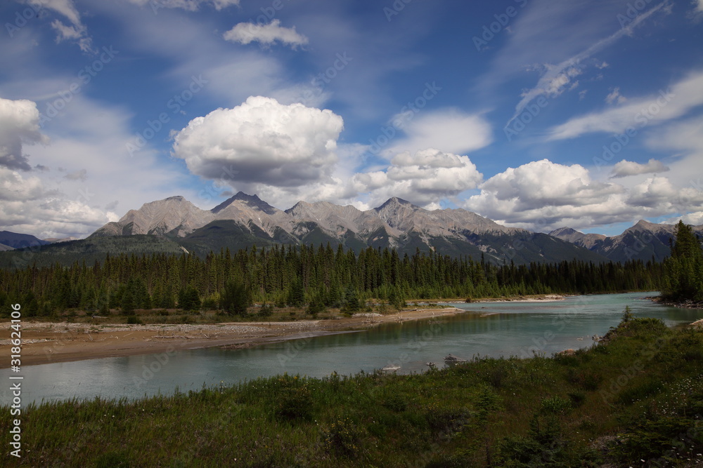 Naklejka premium Lake, Mountain lake, alpine meadows and rocky summits in the Rocky Mountains in Canada, British Columbia, West coast