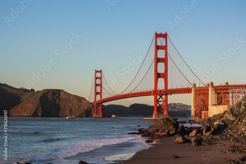 фотография Golden Gate Bridge Over Sea Against Clear Blue Sky
