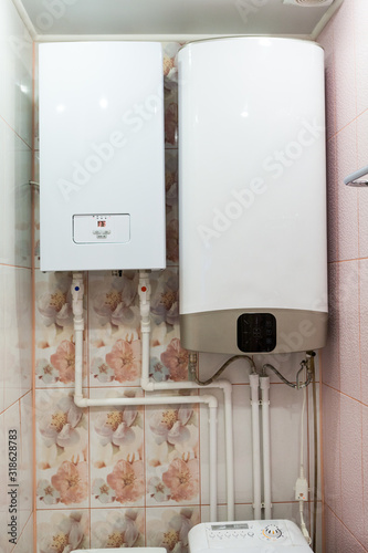 Independent heat-recovery boiler with hot water tank, domestic heating system photo