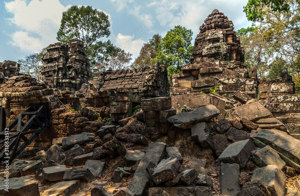 ancient temple complex in Cambodian jungle.