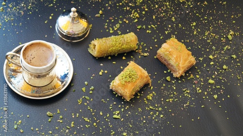 traditional turkish sweet - baklava and turkish coffee on a black background photo