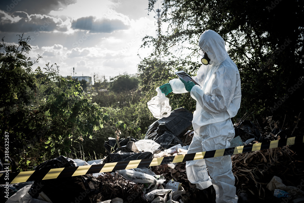 Asian scientist wear Chemical protection suit check danger chemical,working at dangerous zone,Collecting samples in case of Corona virus investigation outbreaked from China.