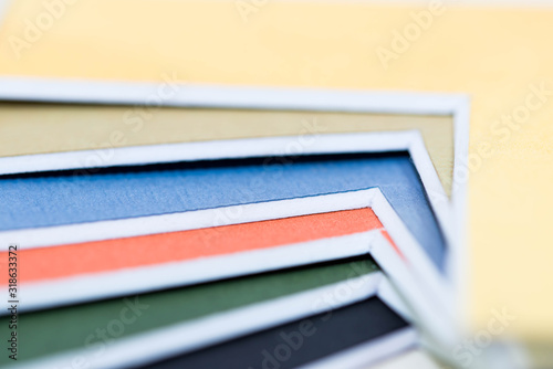Colorful pieces of picture framing  passepartouts close up macro shot, image for background.