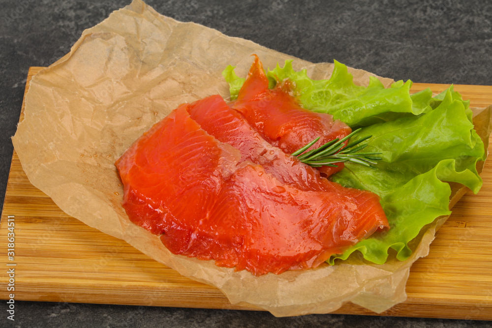 Sliced salmon fillet served rosemary Sliced salmon fillet served rosemary