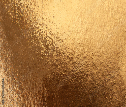 Texture of foiled gold paper with iridescence