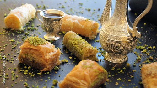 traditional turkish sweet - baklava and turkish coffee on a black background