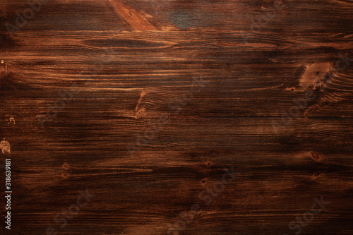 Background texture of old dark brown wood with defects