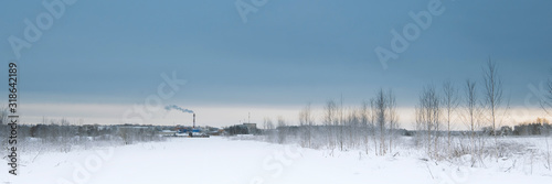 Blue sky with snow field. Great background with copyspace. Winter and snow landscape. Stock photo.
