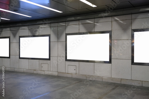 Blank billboard mockup near to escalator in  subway station.