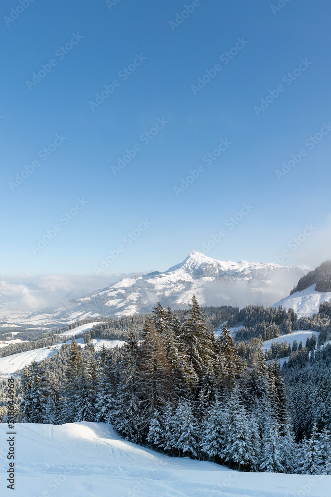Winter view of the Kitzbuhel Alps in Austria with a clear blue sky