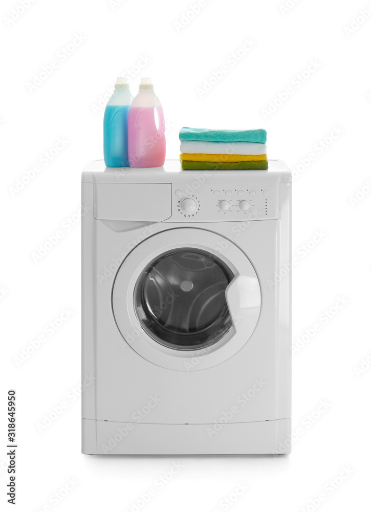 Modern washing machine, stack of towels and detergents on white background. Laundry day Modern washing machine, stack of towels and detergents on white background. Laundry day