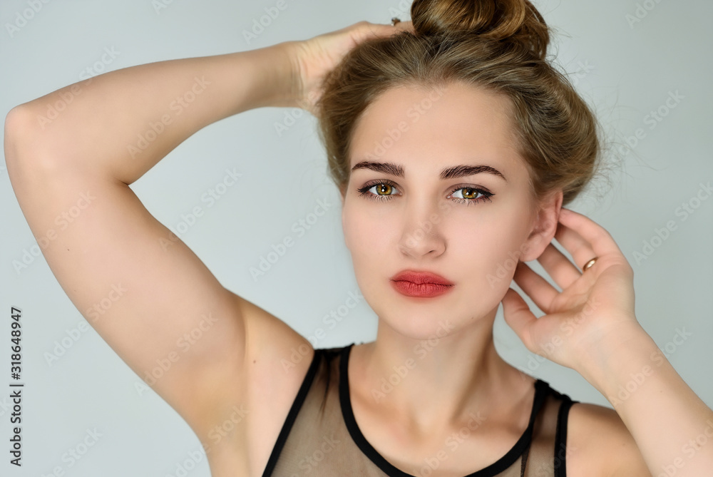 Cosmetics concept, girl face skin care on white background. A close-up portrait of a pretty Caucasian blonde model with long hair with excellent facial skin and good makeup. Cosmetics concept, girl face skin care on white background. A close-up portrait of a pretty Caucasian blonde model with long hair with excellent facial skin and good makeup.