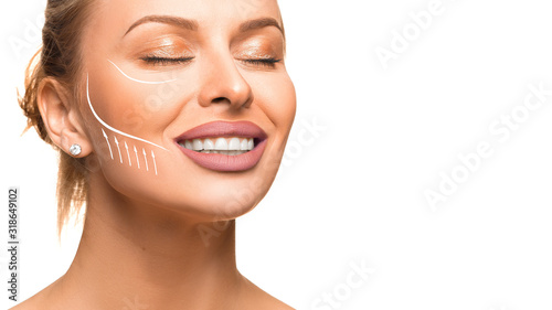 Photos Close up portrait of woman with face-lifting lines and arrows on the face