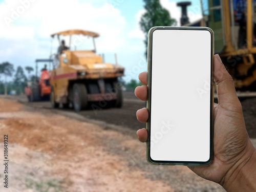Blank screen smartphone And the background blur of the road construction