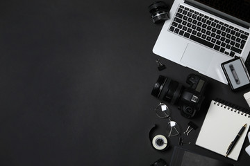 Flat lay composition with equipment for journalist on black background. Space for text