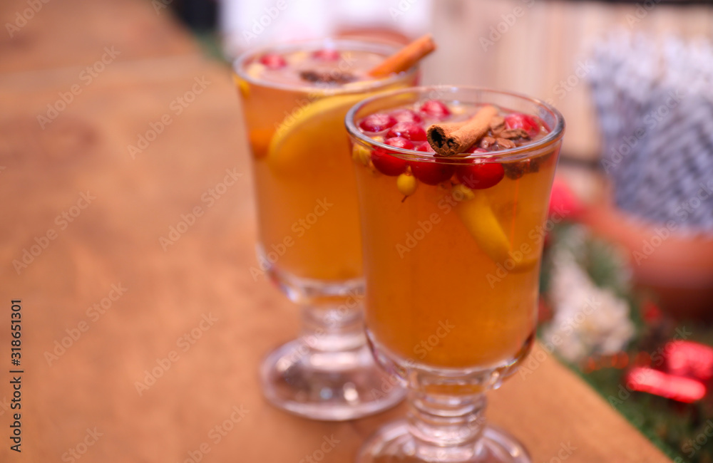 Tasty aromatic mulled wine on wooden table Tasty aromatic mulled wine on wooden table