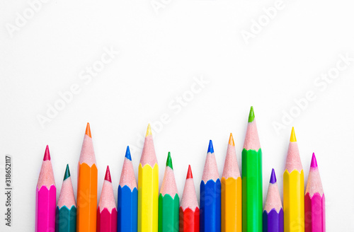 Different color pencils on white background. Composition with colored pencils, closeup view, space for text