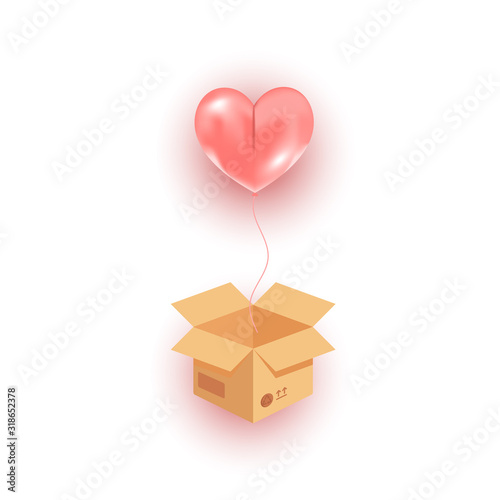 Open cardboard box, flying pink heart helium balloon flying in the air