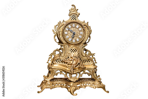 A large, standing clock made of brass with ornaments, isolated on a white background with a clipping path.