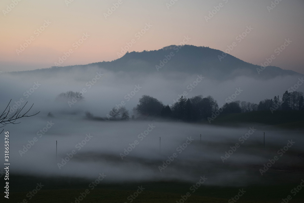 Great view of the foggy Val landscape near Zuerich, Switzerland.
