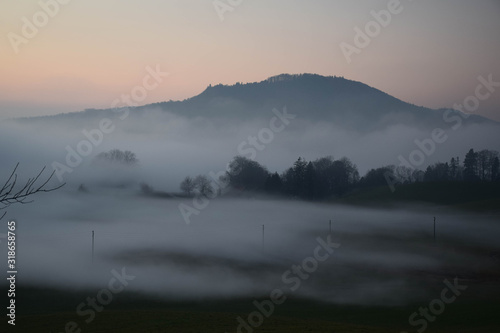 Great view of the foggy Val landscape near Zuerich, Switzerland.