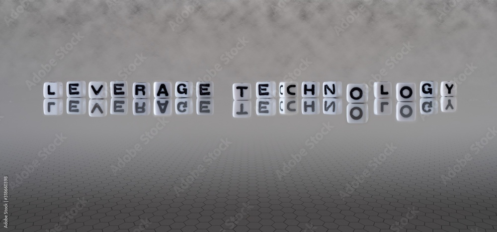 Φωτογραφία leverage technology concept represented by wooden letter tiles