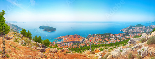 Aerial panoramic view of Lokrum island and Old Town of Dubrovnik on a sunny da