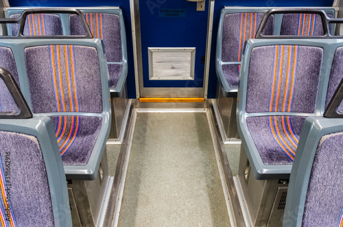 Isolated commuter train bench row seating. 