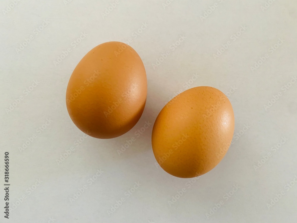 two brown eggs isolated on white background two brown eggs isolated on white background