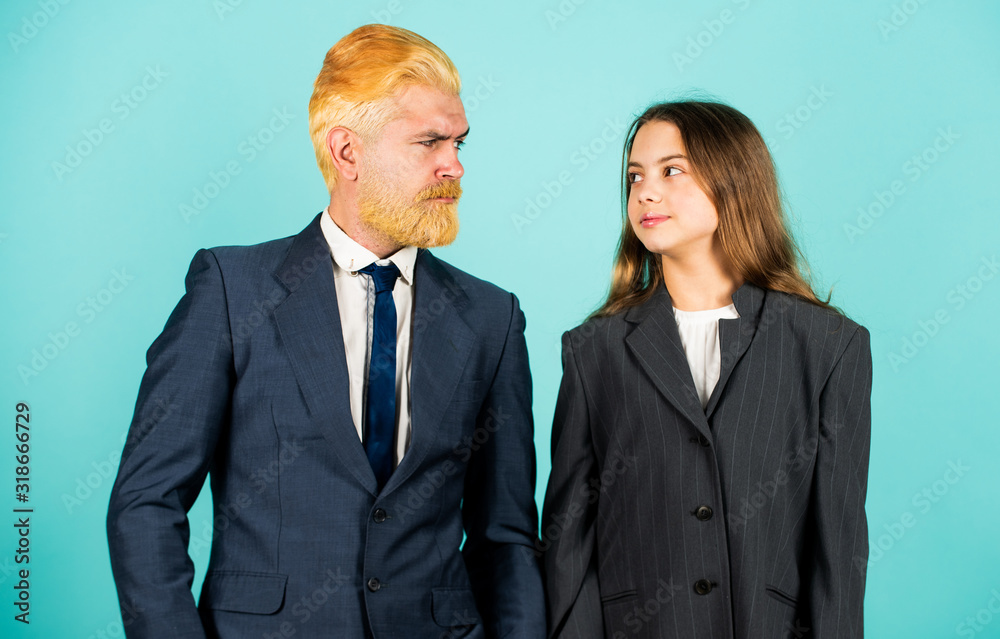 Bank concept. small girl in oversized jacket. choosing future career. family business startup. kid in business school. father and daughter in suit. modern office life. businessman dyed blond hair Bank concept. small girl in oversized jacket. choosing future career. family business startup. kid in business school. father and daughter in suit. modern office life. businessman dyed blond hair