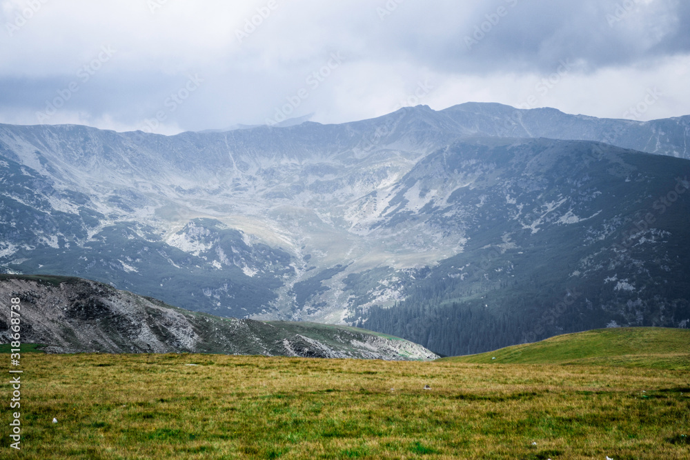 Landscape with mountains, green hills and cloudy sky, Transalpina road, Romania. Landscape with mountains, green hills and cloudy sky, Transalpina road, Romania.