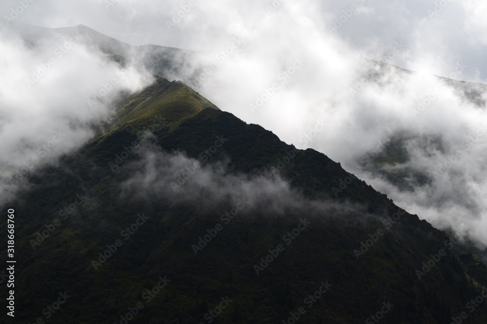 Clouds surrounding the mountains view from the transfagarasan road.