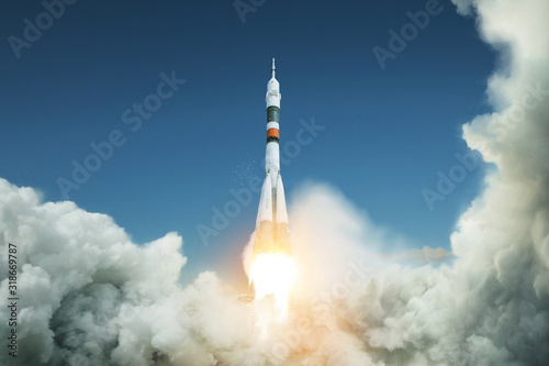 Fototapeta Naklejka Na Ścianę i Meble -  Space rocket takes off into the sky. Spacecraft launched. Successful start
