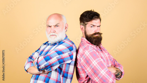 family values. male beard care. checkered fashion. father and son family. generational conflict. youth vs old age compare. retirement. barbershop and hairdresser. two bearded men senior and mature © be free