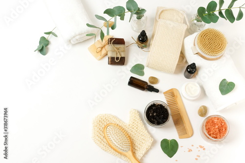 Spa background with wellnes, bath products zero waste , sea salt, towels, aroma oil in bottles on white backdrop. Beauty, body care concept. copy space
