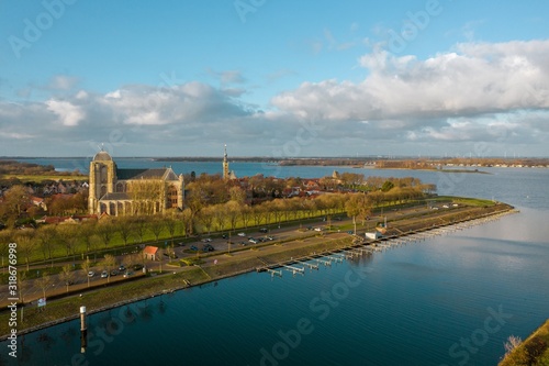 High angle shot of a beautiful river surrounded by buildings in Veere, The Netherlands photo