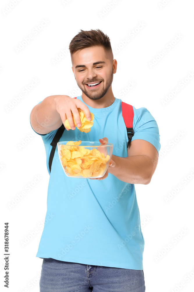 Handsome male student with tasty potato chips on white background Handsome male student with tasty potato chips on white background