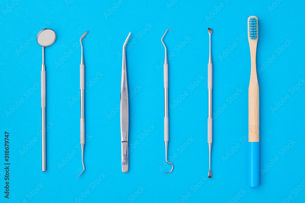 Dentist tools over blue background top view Dentist tools over blue background top view