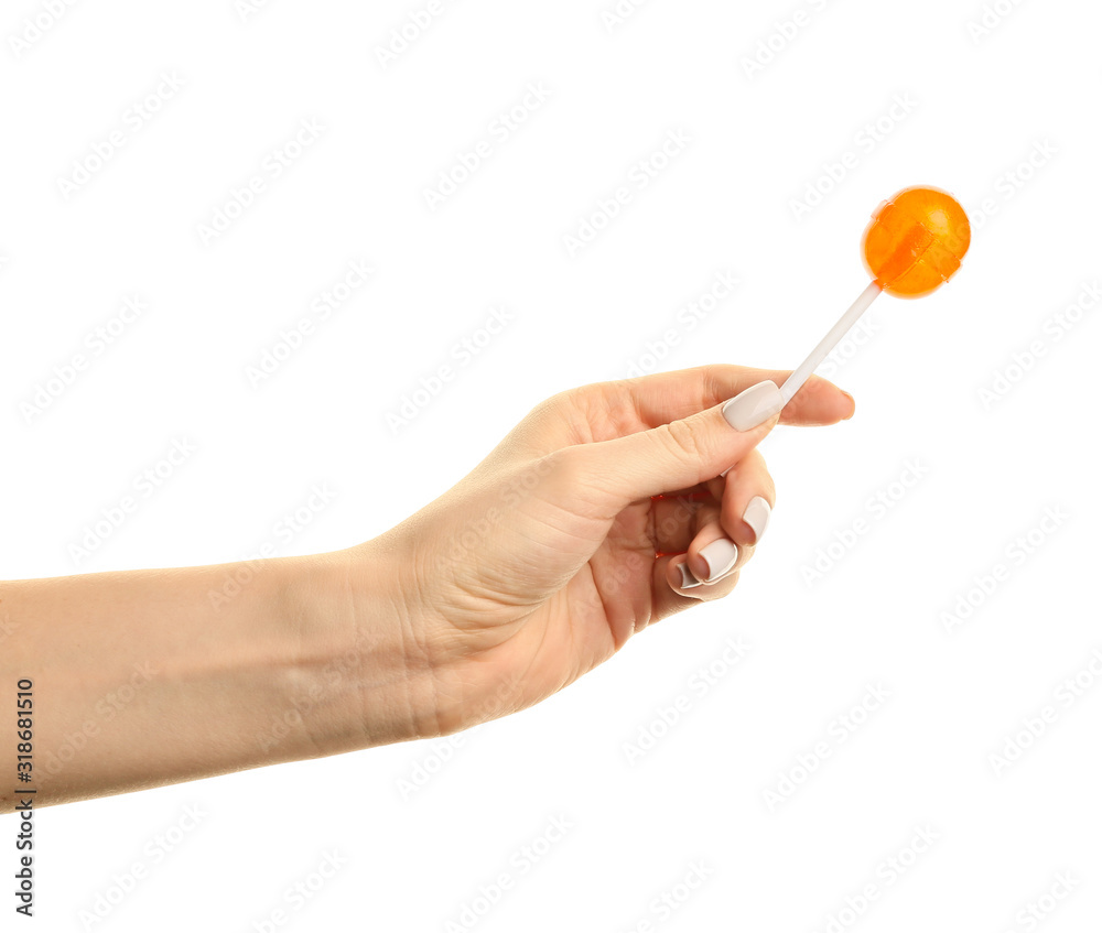 Female hand with sweet lollipop on white background