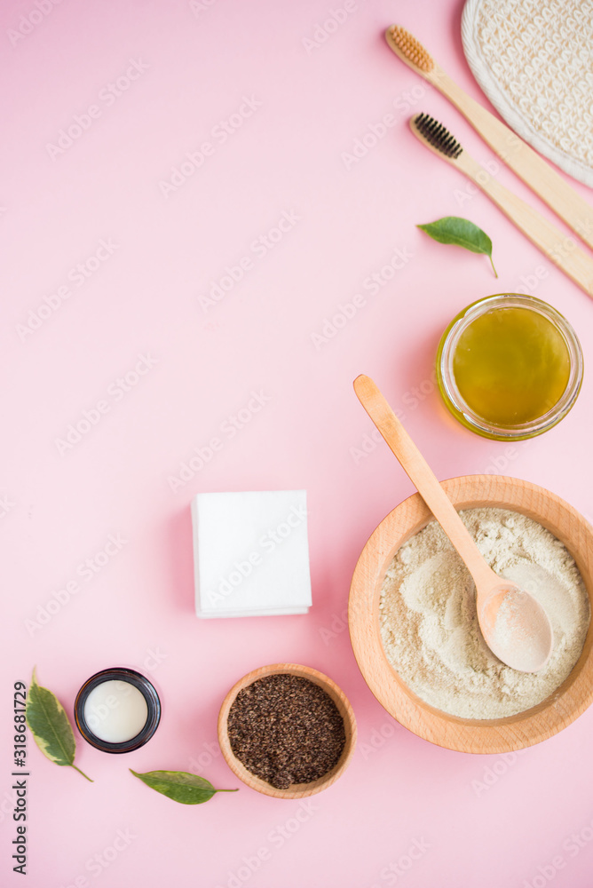 Cosmetic bath salt, grape gomaj for the face, coffee scrub for the body on a pink background. Cosmetic bath salt, grape gomaj for the face, coffee scrub for the body on a pink background.