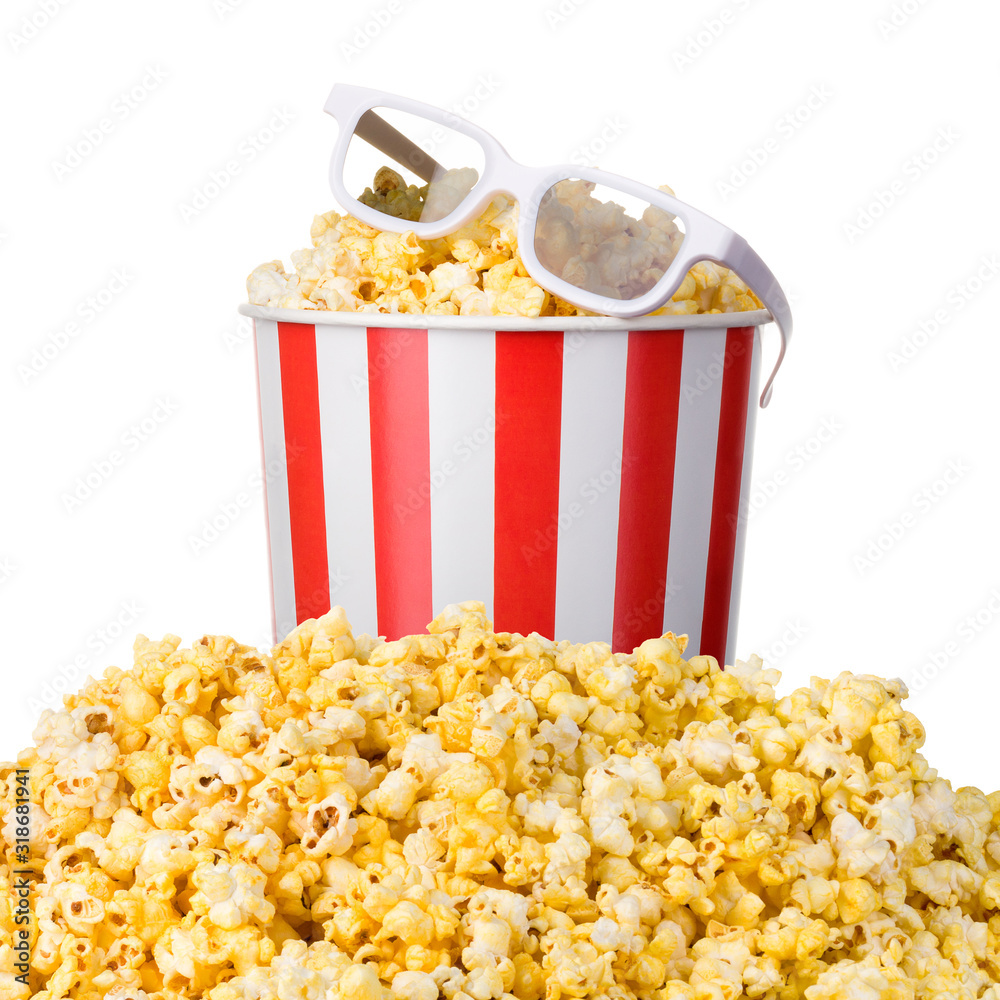 Paper striped bucket and 3D glasses on a heap of popcorn isolated on white Paper striped bucket and 3D glasses on a heap of popcorn isolated on white