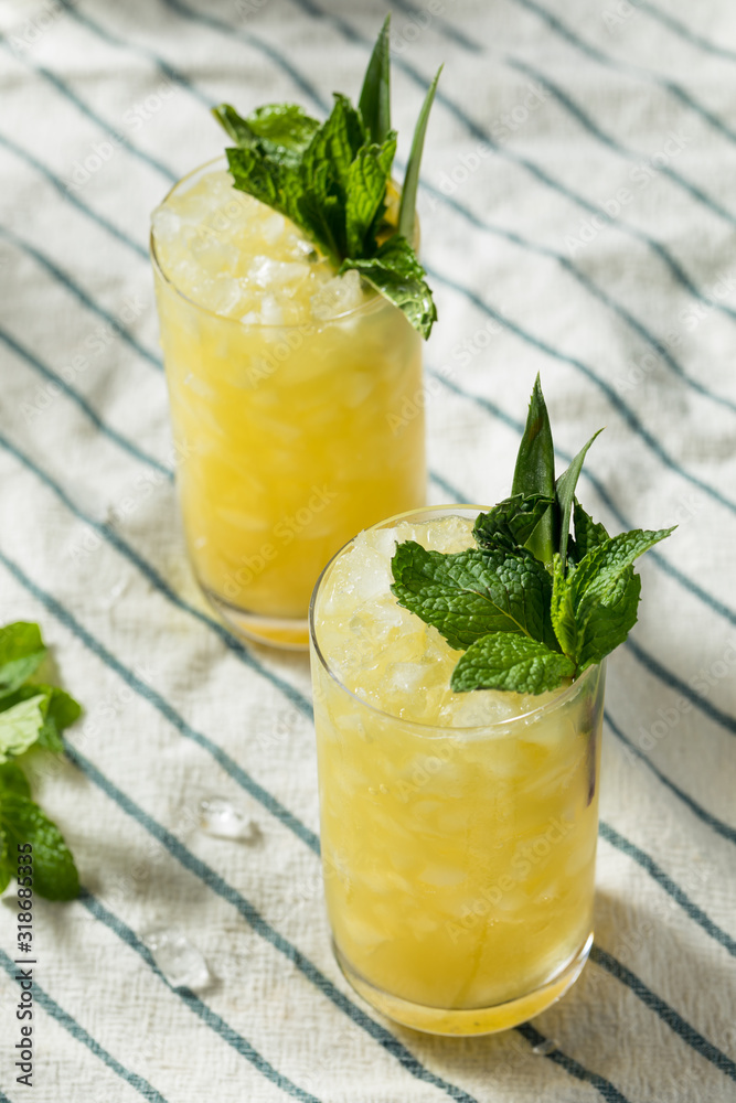 Fototapeta premium Homemade Boozy Green Chartreuese Swizzle Cocktail
