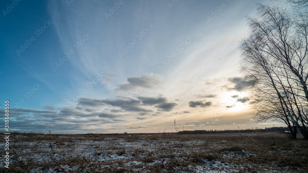 Beautiful setting sun over frozen field Beautiful setting sun over frozen field