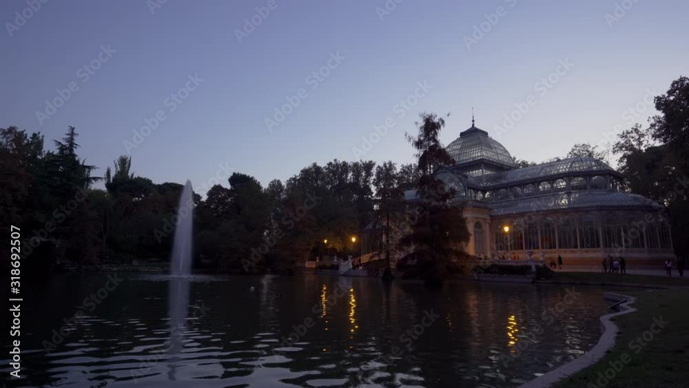Sunset view of Crystal Palace or Palacio de cristal in Retiro Park in Madrid, Spain. The Buen Retiro Park is one of the largest parks of the city of Madrid, Spain Sunset view of Crystal Palace or Palacio de cristal in Retiro Park in Madrid, Spain. The Buen Retiro Park is one of the largest parks of the city of Madrid, Spain