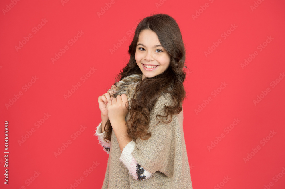 Beautiful model kid. Fashion concept. Best shampoos and conditioners for lush hair. Nourish dull and damaged hair. Girl long curly hair. Little beauty smiling red background. Happy childhood
