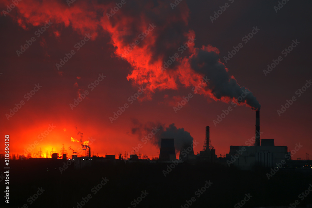 Beautiful sunrise over a power plant. Ecology problems. Environmental pollution.